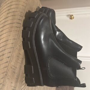 Black platform heeled ankle boots